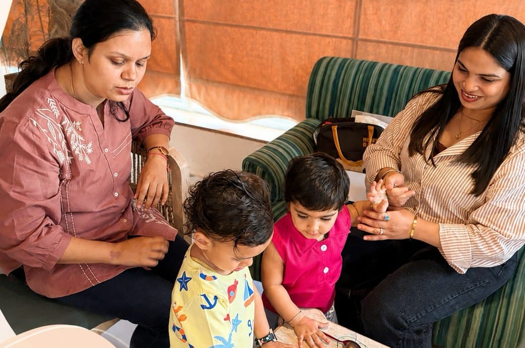 Two moms and their toddlers enjoying a Play and Pause creative playdate in Jaipur